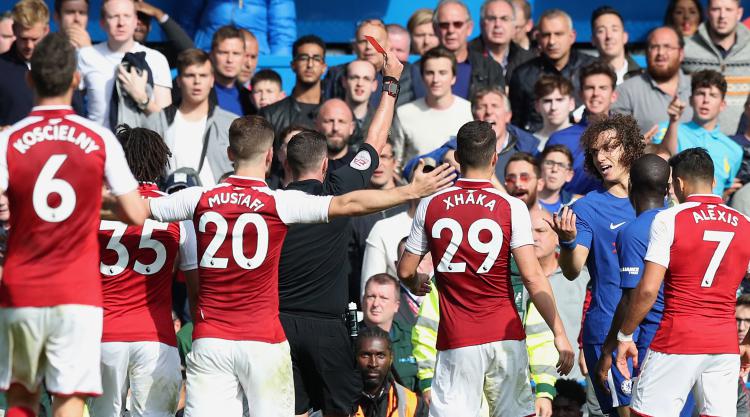 Arsenal battle to deserved point at 10-man Chelsea