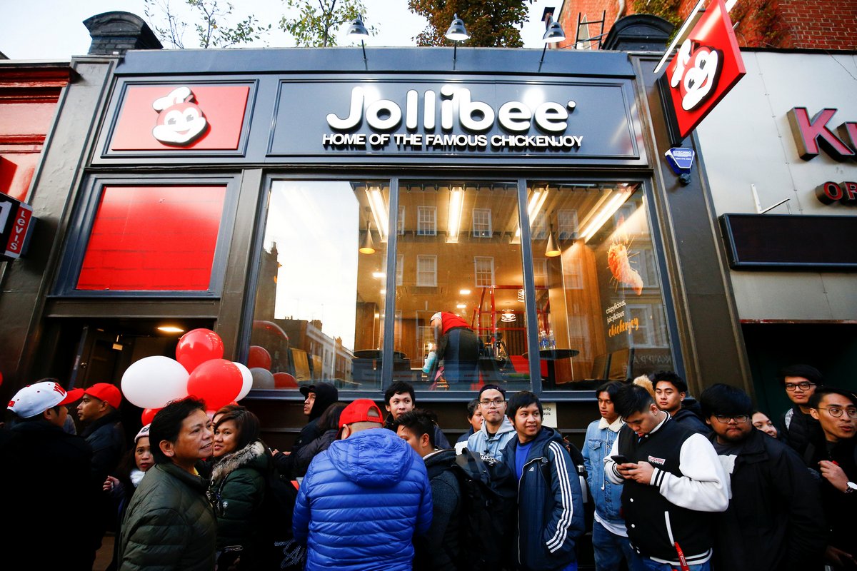 Crowds brave London chill for Philippine fast-food giant Jollibee's British debut