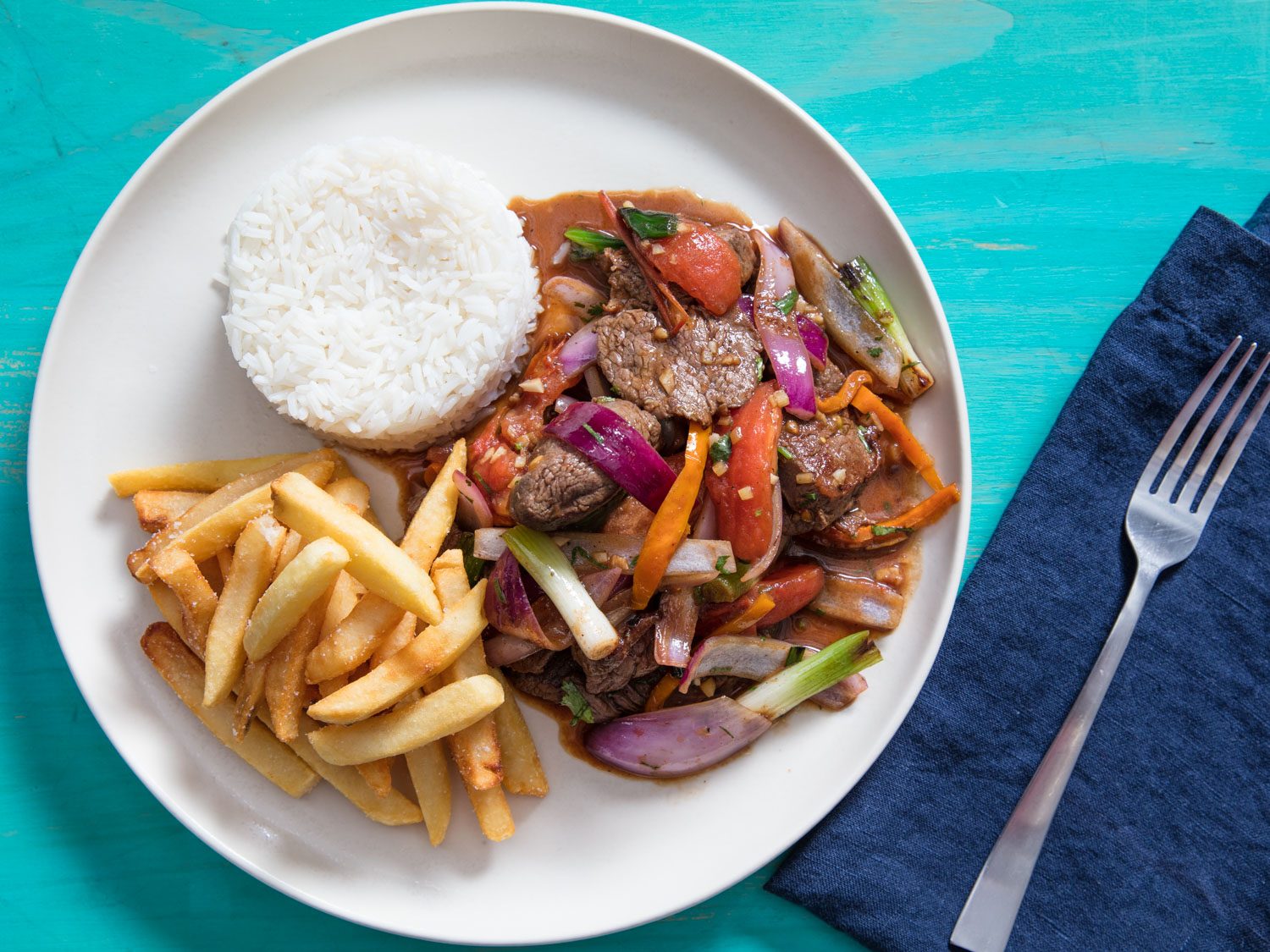 Lomo Saltado (Peruvian Stir-Fried Beef With Onion, Tomatoes, and French Fries)